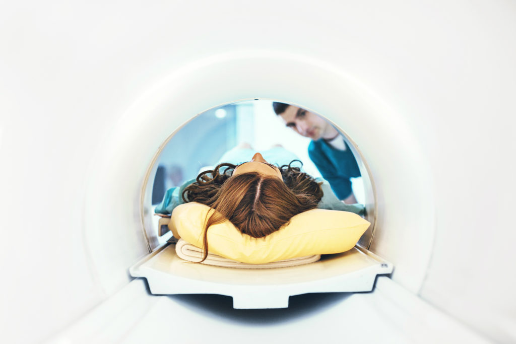 a woman undergoing a MRI scan for sinus surgery